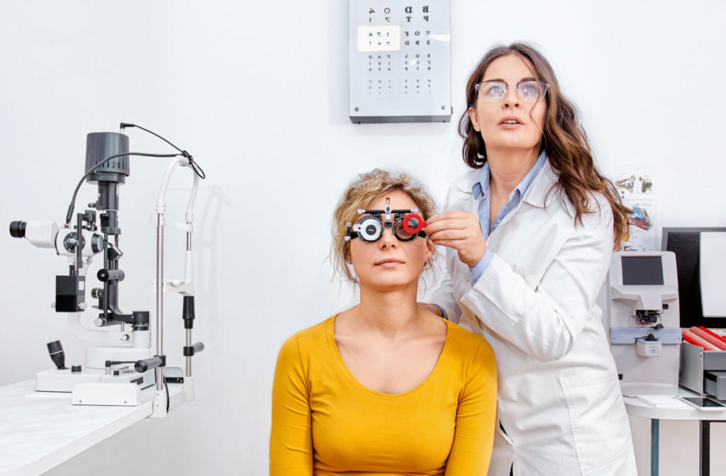 A woman undergoes a regular eye exam for a new prescription of her eyeglasses